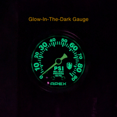 Glow-in-the-dark pressure gauge with 'Apex' branding on a black background
