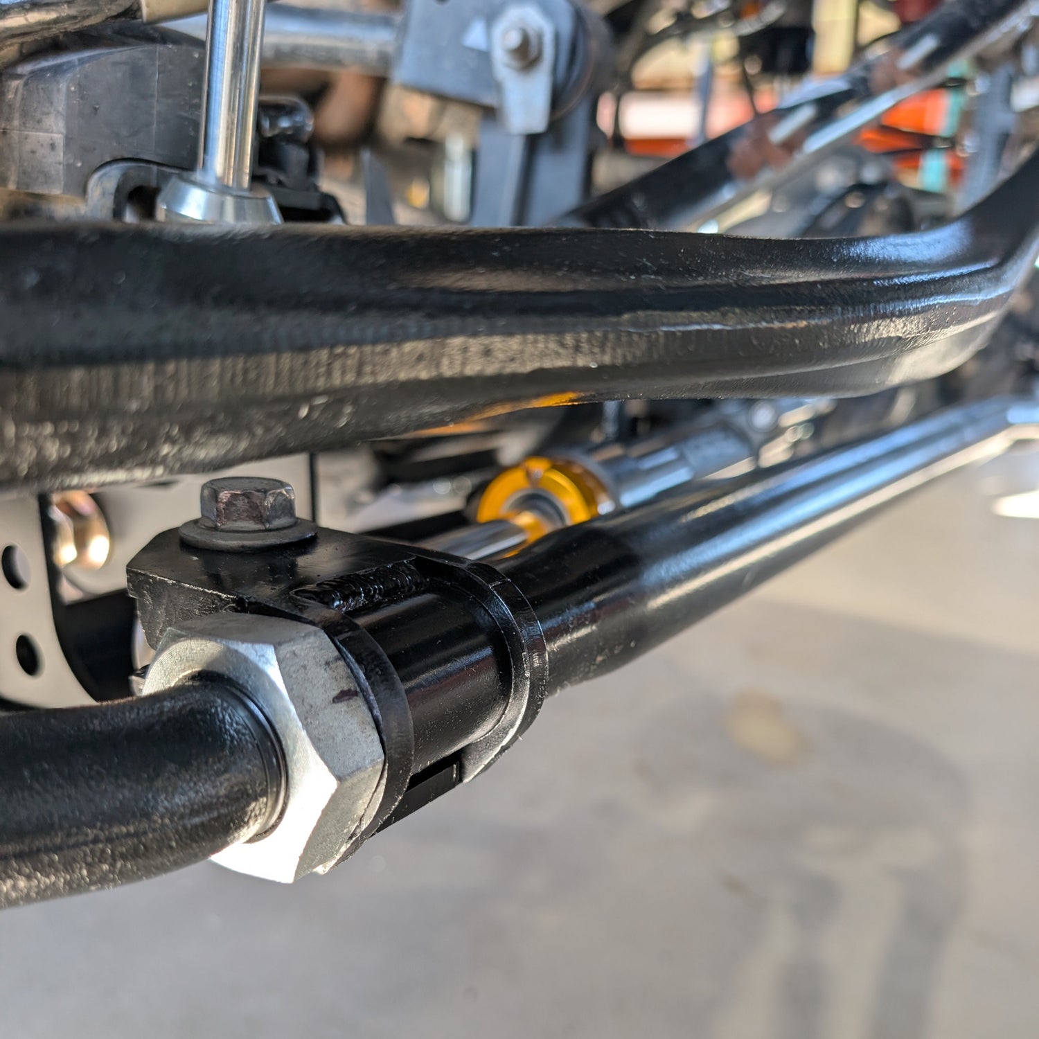 Close-up of the Apex Through Shaft Ram Steering Ram with RockJock Tie Rod